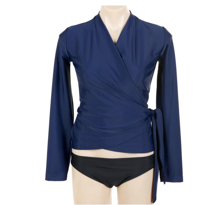 A stylish sun safe rash vest for women that wraps around and is